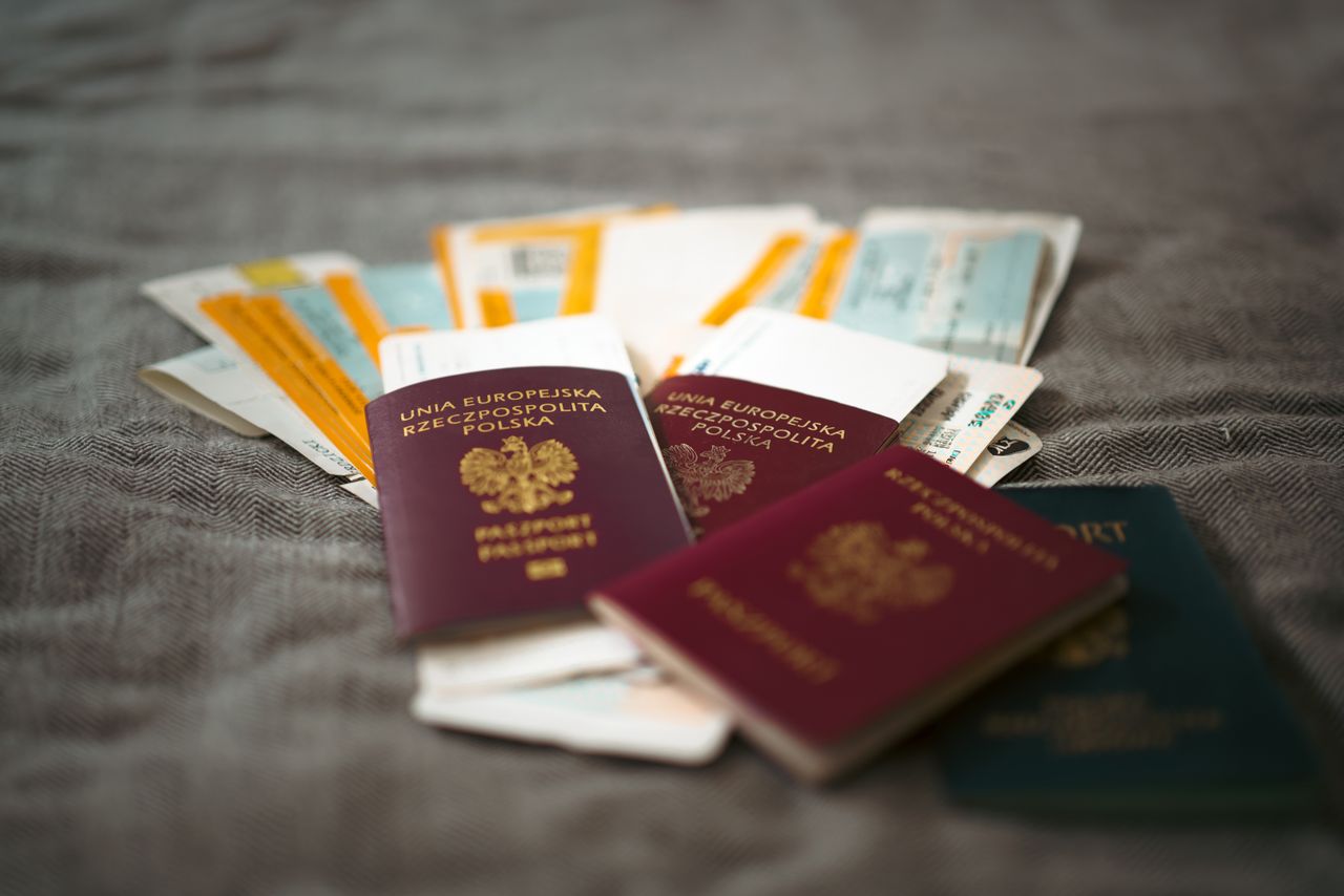 Crafting Captivating Headlines: Your awesome post title goes here Close-up of Polish passports and travel tickets symbolizing travel and adventure.